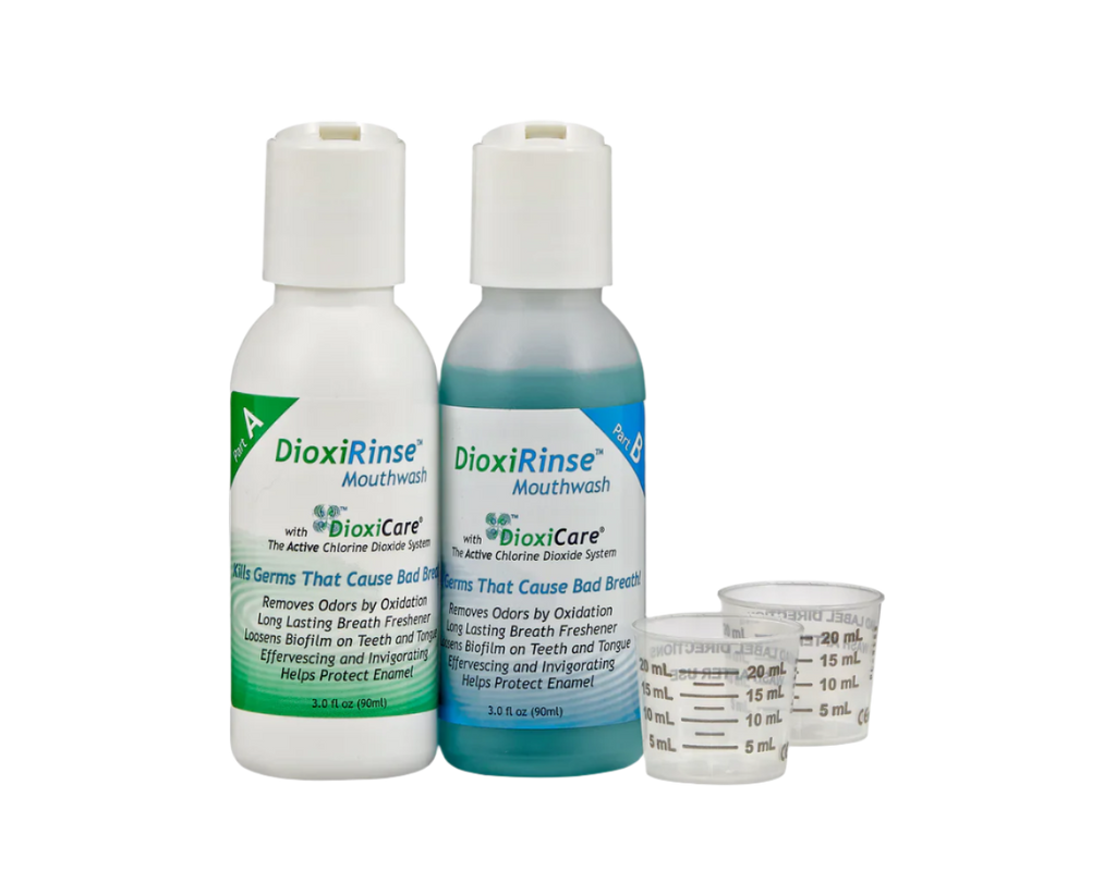 Two bottles of DoxiRinse mouthwash with a measuring cup on a white background